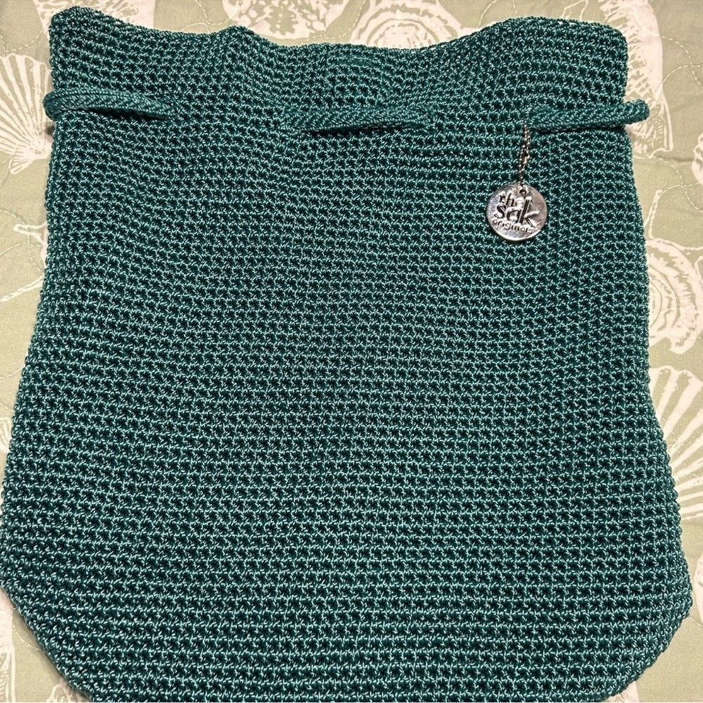 The Sak Turquoise Crocheted Knit Backpack.